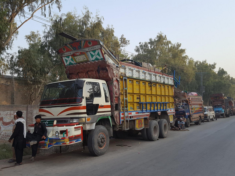 Trucks loaded and ready to carry refugees and their household furniture back to Afghanistan