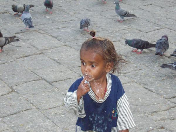 Baby and the birds in Mumbai