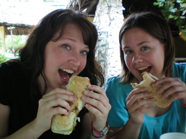 Amanda and I consuming some very large Guatemalan hot dogs