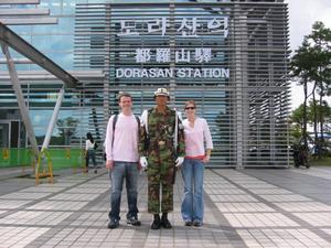Andrew and Fiona flank a South Korean soldier