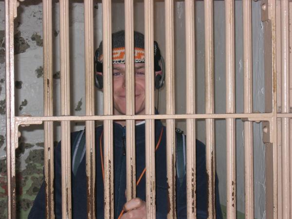 Andrew in a cell