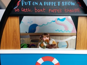 Ella does a puppet show