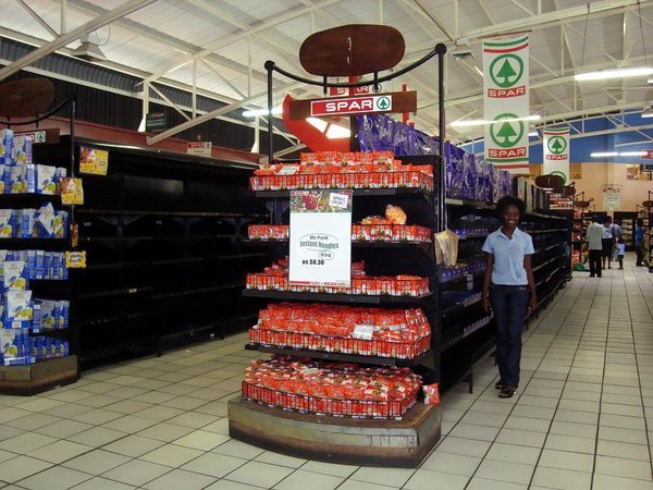 Emily displaying the Zimbabwe store shelves phenomenon