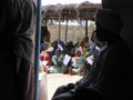 Refugees waiting outside to receive their cards