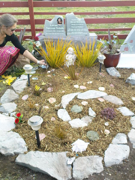 Naeri beside the Headstone