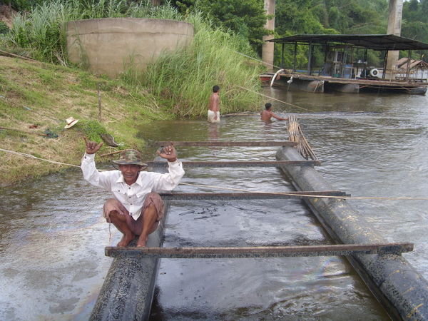 A Thai man on a river Kwai