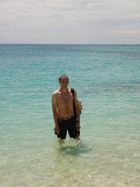Darren standing in the crystal clear ocean @ Whithaven Beach