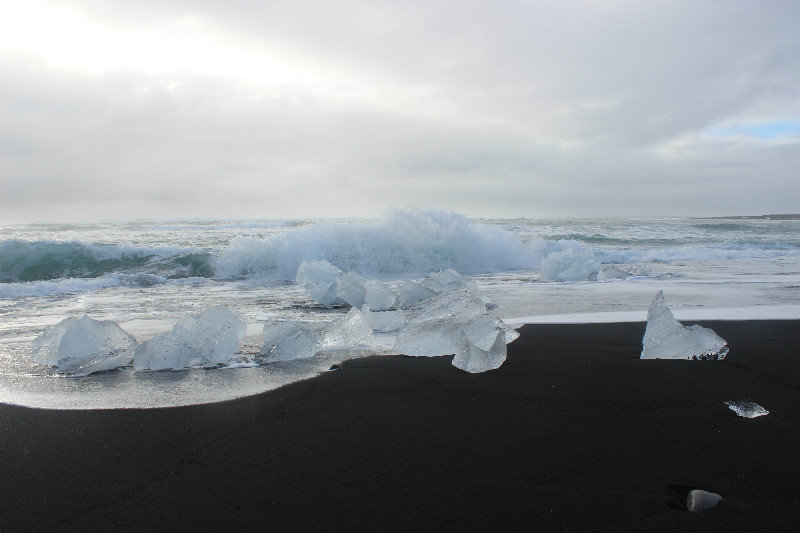 Ice on black sand beach