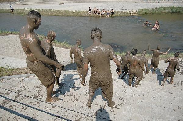 Mud men going to bathe