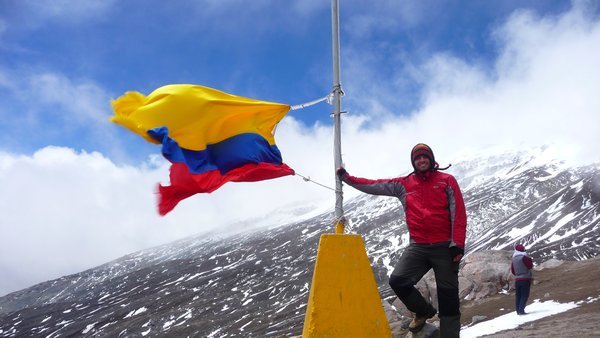 Neil with Colombian flag on the mountain at Parque los Nevados