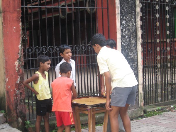 Kids play carrom outside Tagore's house