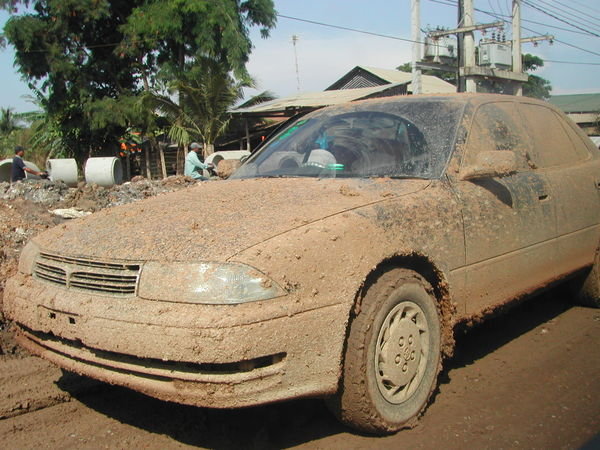 Muddy cars in Poipet