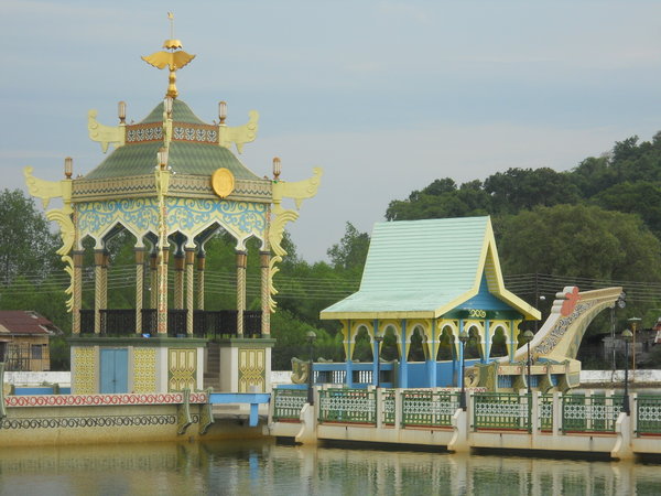 Ornate follies in the water beside the mosque