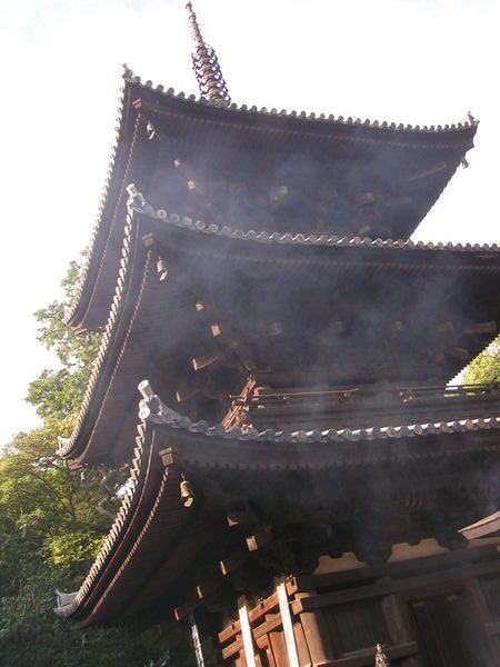 incense smoke in front of pagoda