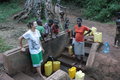 Ariana and the kids filling up the water jugs