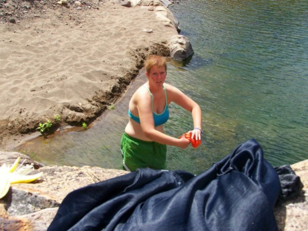 and was apparently surprised to have my photo taken while rining out my clothes to let them dry on the rocks
