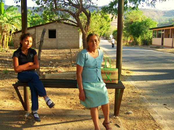 milagro y mamita at a bus stop in san lucas
