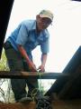 don sabino helping fix mamita's roof