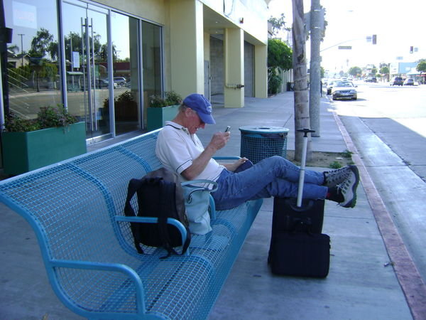 Feet up at the bus stop mission accomplised camera in the bag