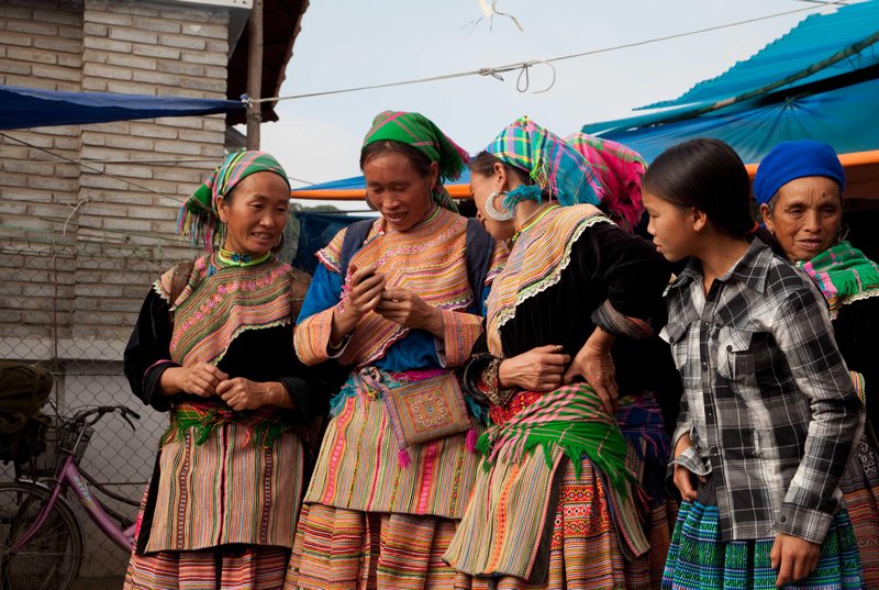 A group of Hmong with a cell phone
