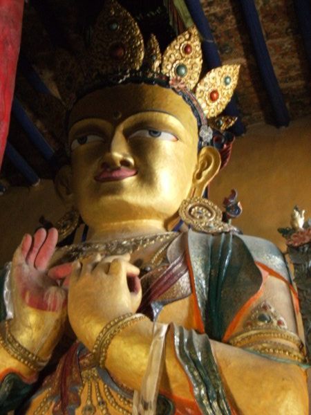 Inside Namgyal Tsemo Gompa - three-storey high Sakyamuni, the historical Buddha