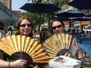 Kerry and Sarra embracing local culture with traditional Chinese fans