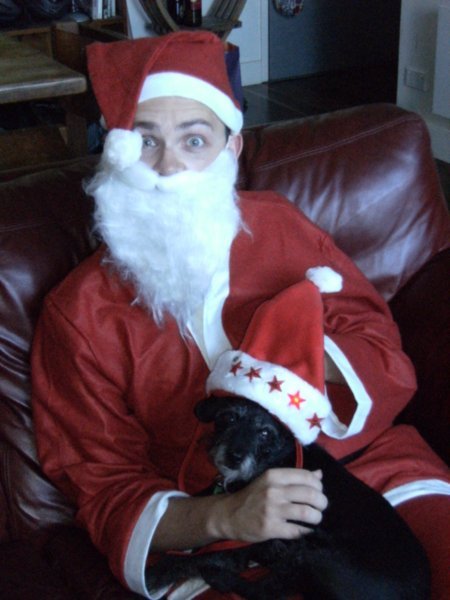 Santa and Mr P pose for a Christmas portrait
