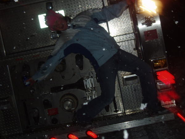 me on the back of the firetruck