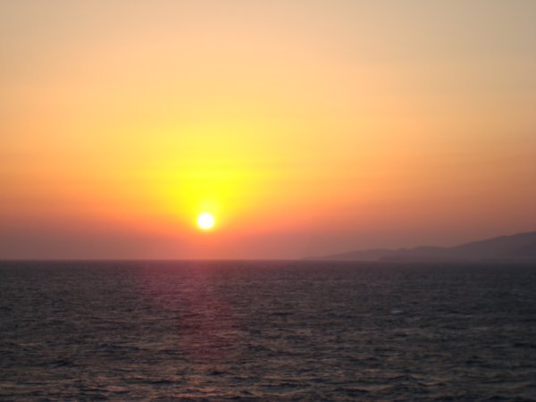 Sunset on the approach to Mykonos