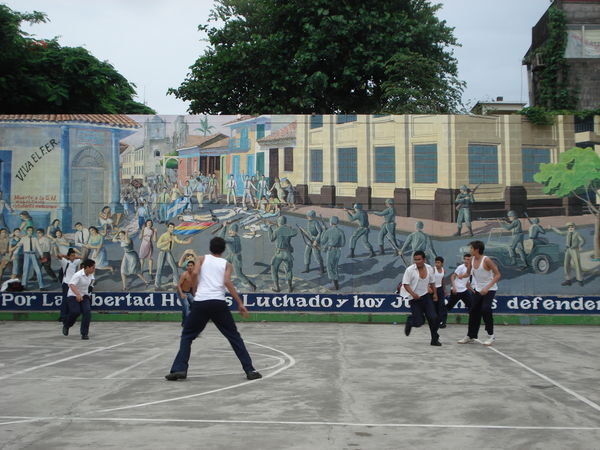 A mural representing the history of the country, and the freedom won shown by the kids playing football
