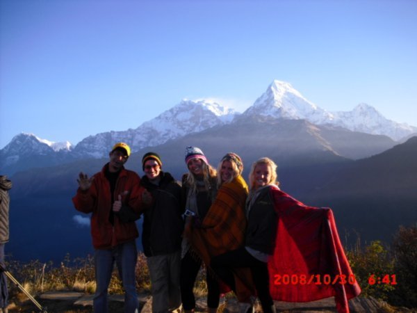 all the crew at the top of Poon Hill 3200m with the sun rising over the Himalayas