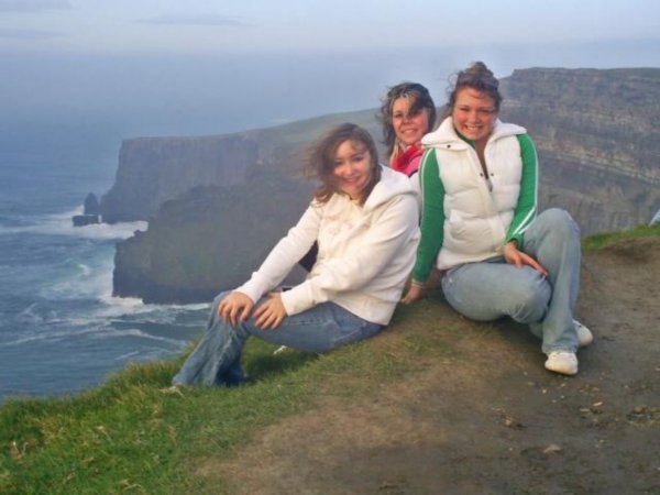 the girls and i sitting on the cliff