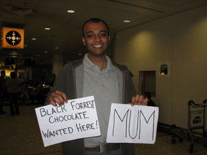 Rupesh With Signs For Mum at Heathrow