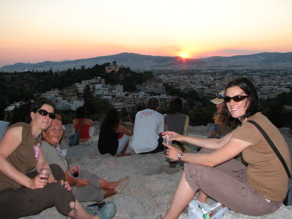 Sipping our Ouzo while we watch the sunset from near the Acropolis