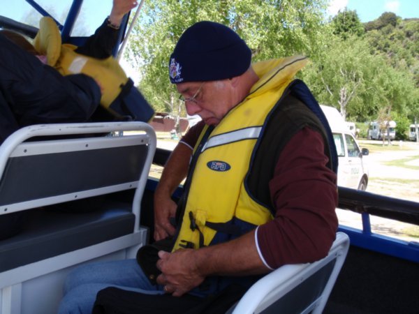 Wim doing up his life jacket on the water taxi