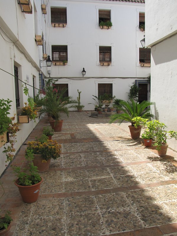 8 courtyard leading to entrance of hotel