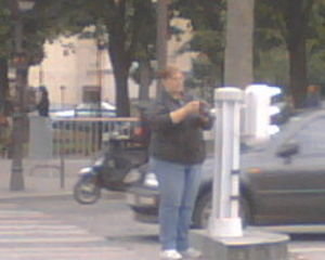 Mum taking photos in the middle of Champs de Elysee in Peak Hour!