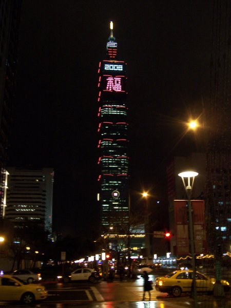 taipei 101 lit up at night..  w. some celebratory decorations in time for chinese new year