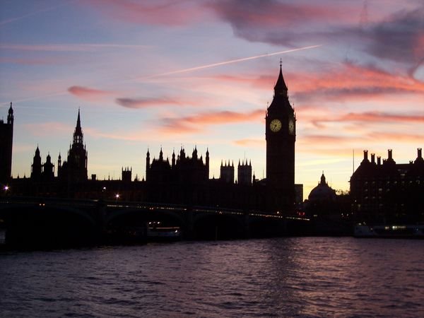the sun setting on parliament and big ben