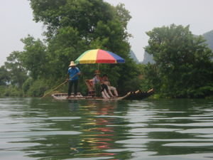 Bamboo rafts passing us as we swam