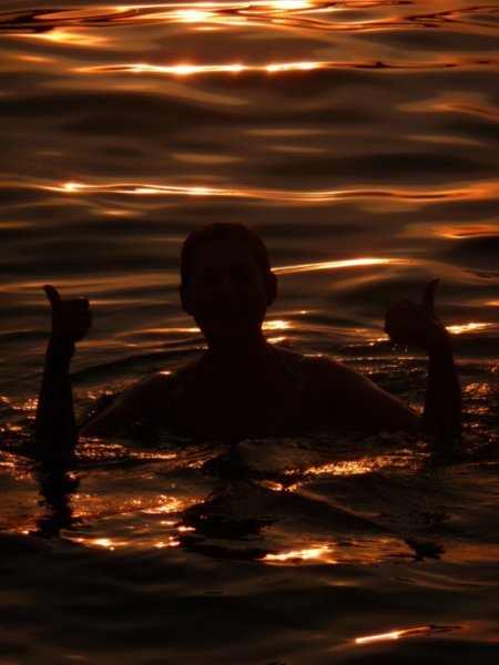 swimming at sunset