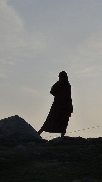 monk silhouetted at Triund