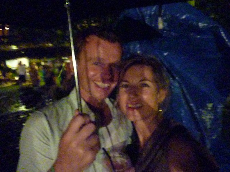 hiding from the rain at Michael Franti concer