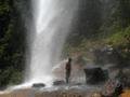 Nantu showering under the waterfall
