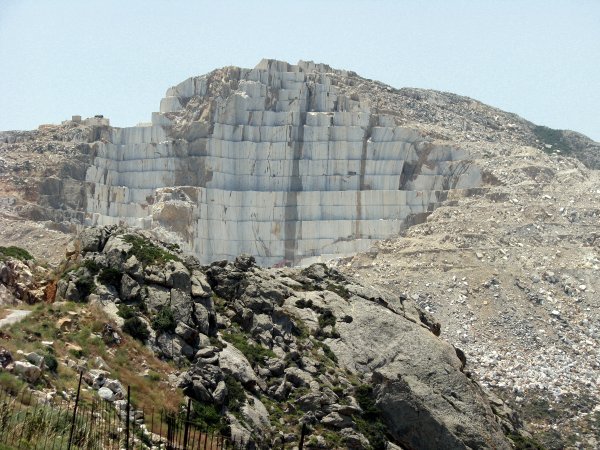 The marble quarry cuts massive marble blocks out of the mountain
