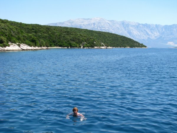 Swimming off the boat  Mainland Croatia in background