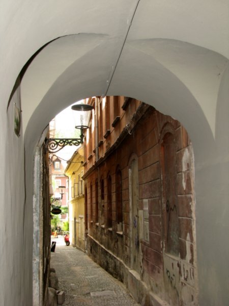 Narrow street through arch