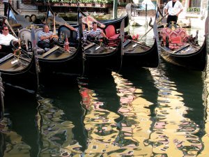 Gondoliers waiting for customers in afternoon reflections
