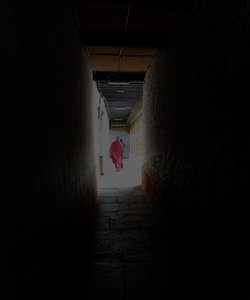Monk walking down the corridor