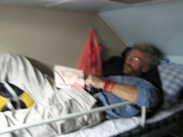 Ed relaxing in the top berth of Hard sleeper train to Yangshou
